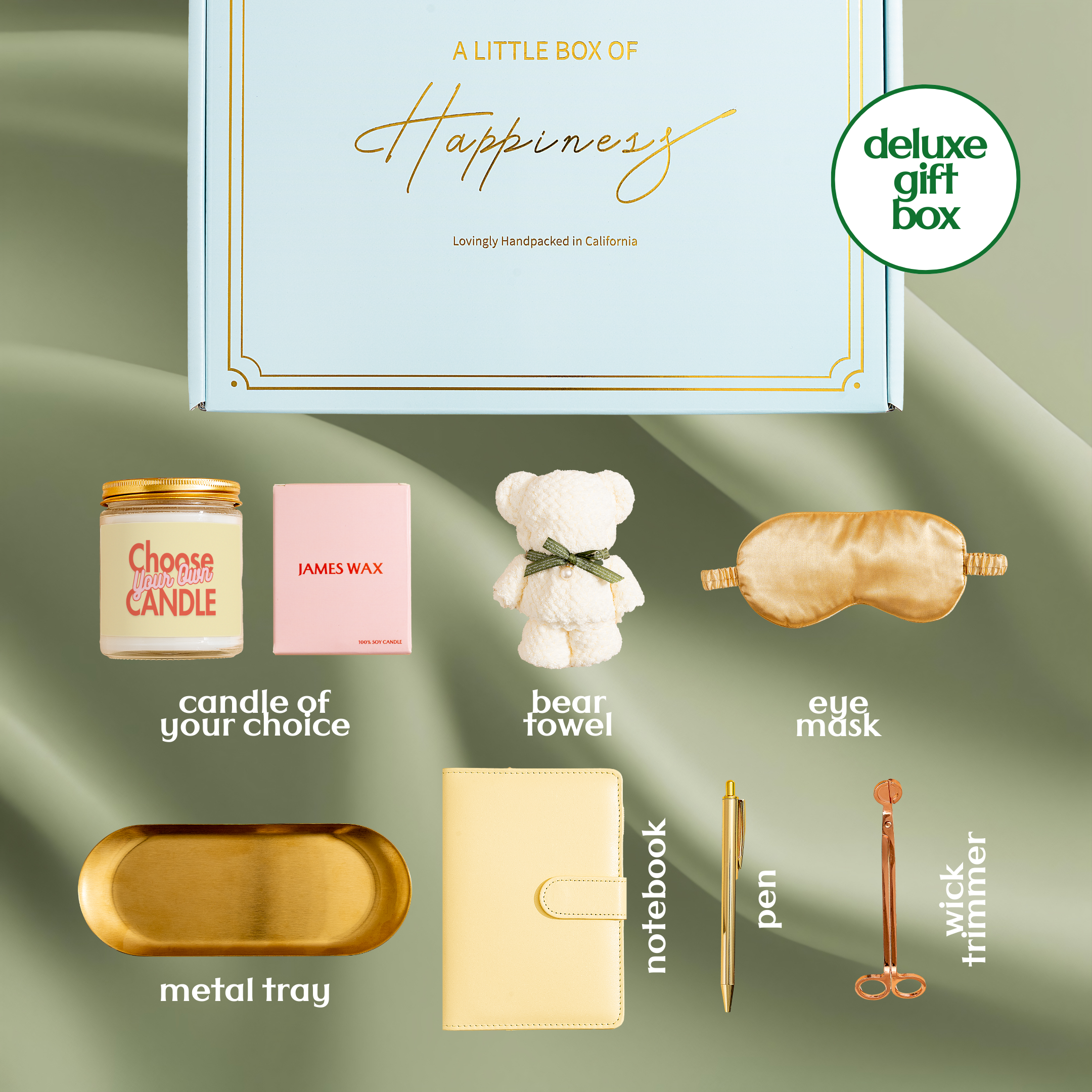 a variety of items, including a candle, a teddy bear, a metal tray, a notebook, a pen, a eye mask, a sleeve, a sleeve, and a pair of scissors.