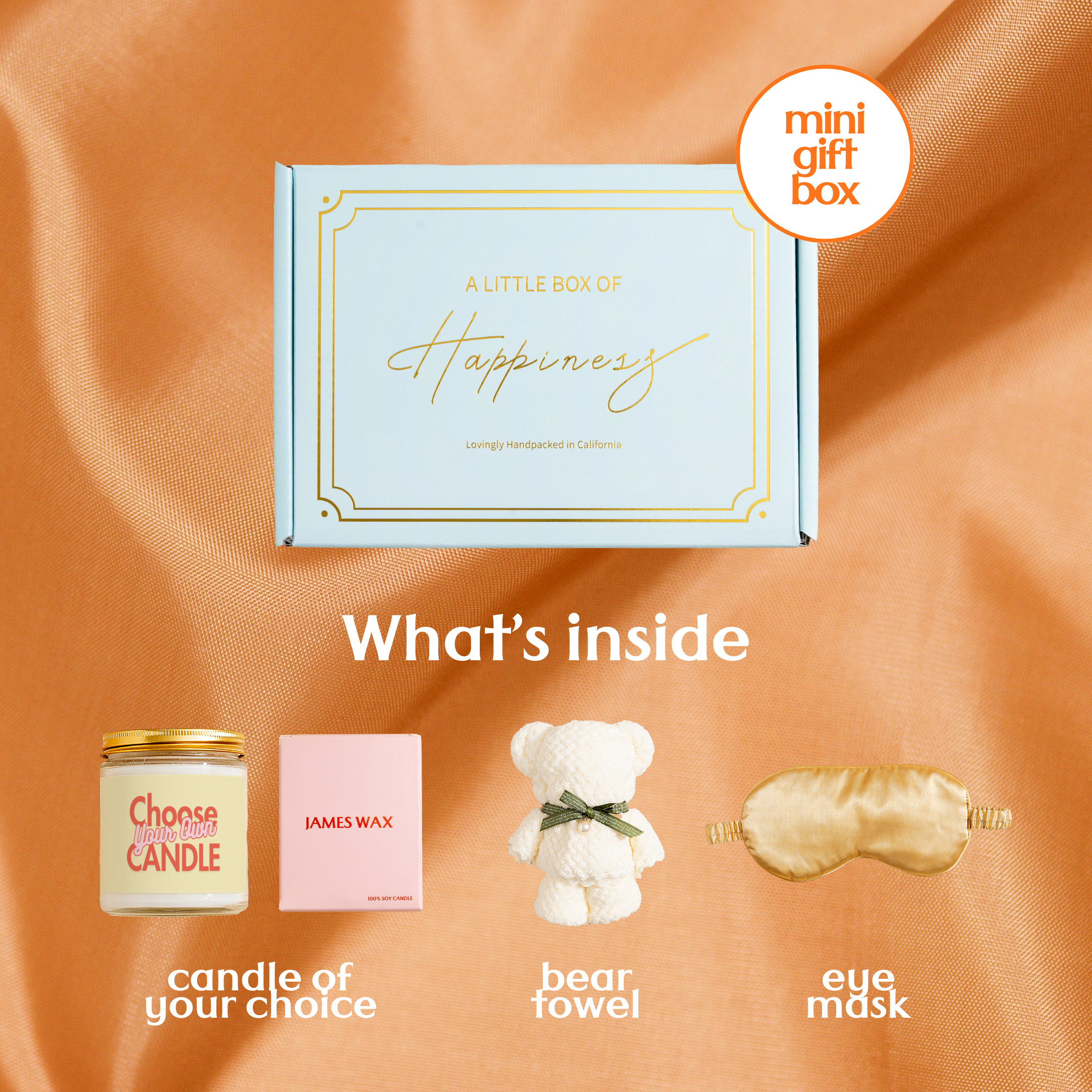 a gift box with a candle, a teddy bear, a sleep mask, and a pair of earplugs, all arranged on a textured orange background.