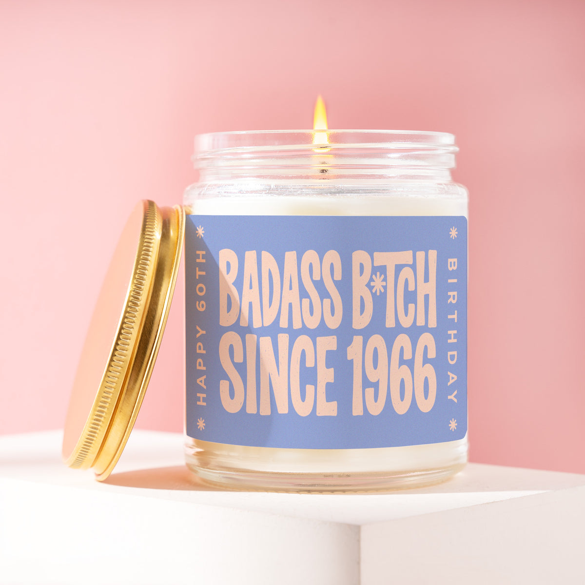 Badass B*tch Since 1966 9 oz soy candle with a brushed gold lid by James Wax