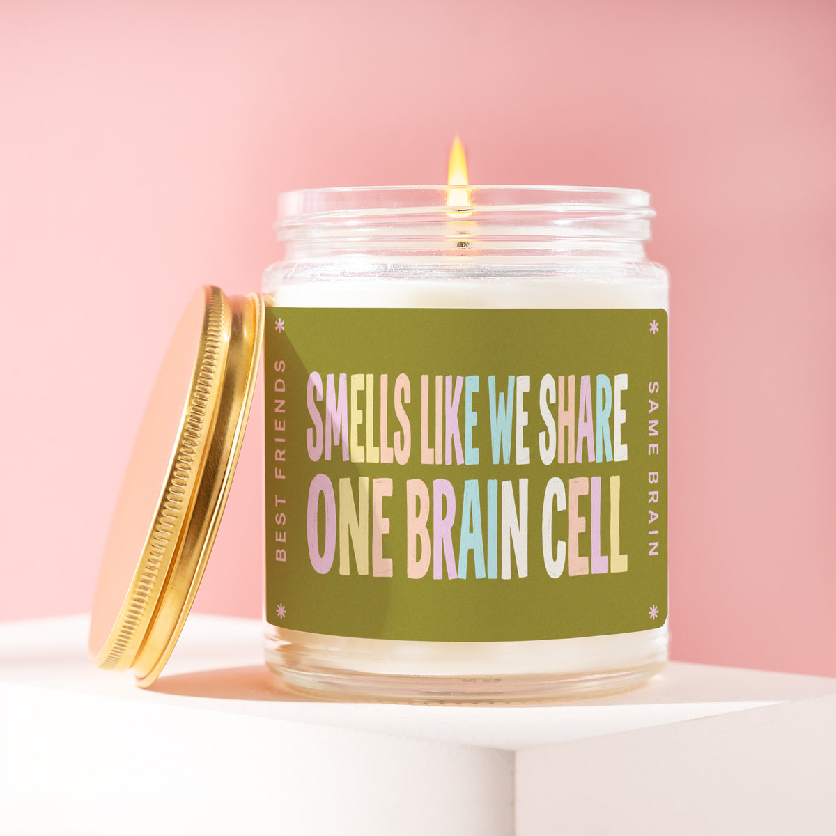 Smells Like We Share One Brain Cell 9 oz soy candle with a brushed gold lid by James Wax