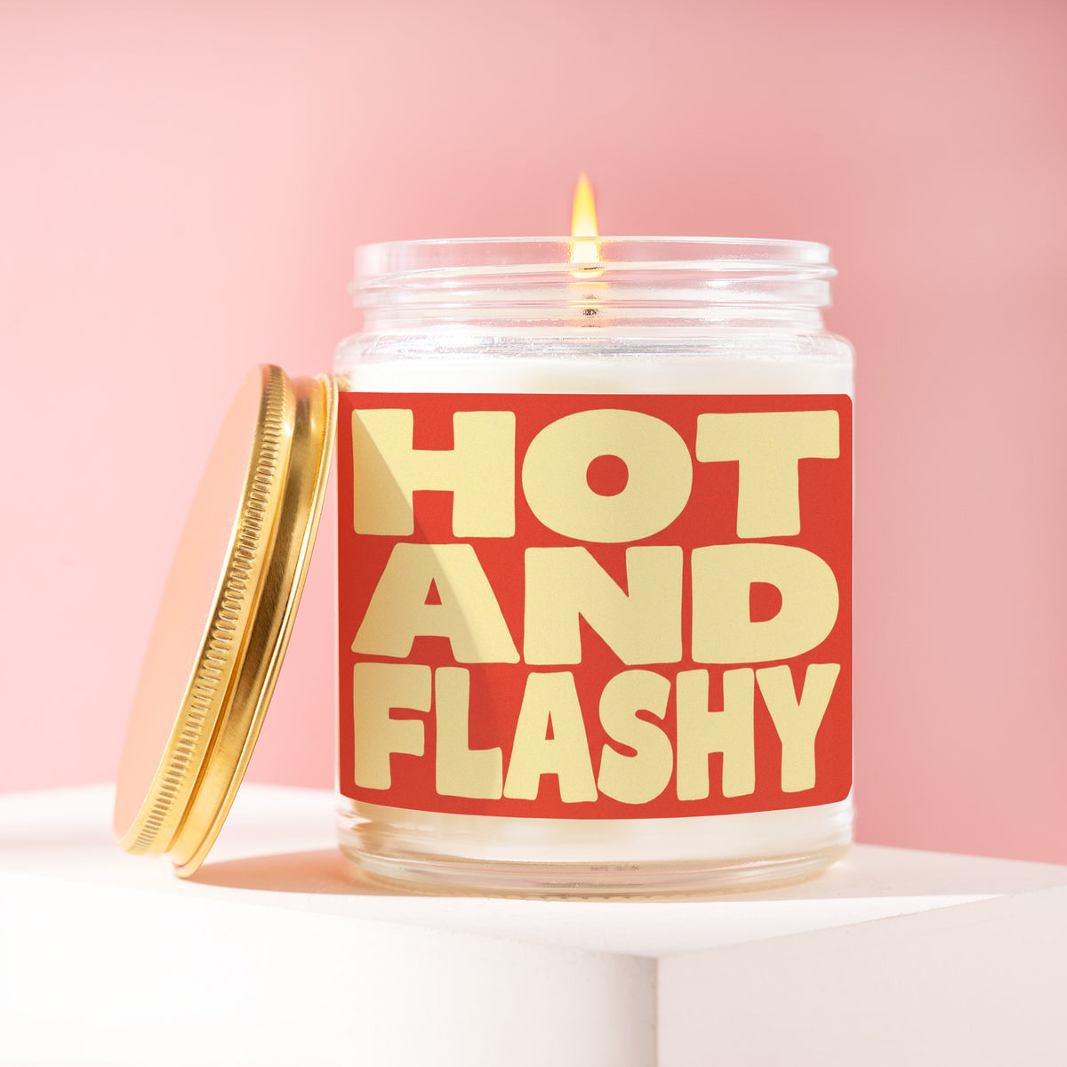 Hot And Flashy 9 oz soy candle with a brushed gold lid by James Wax