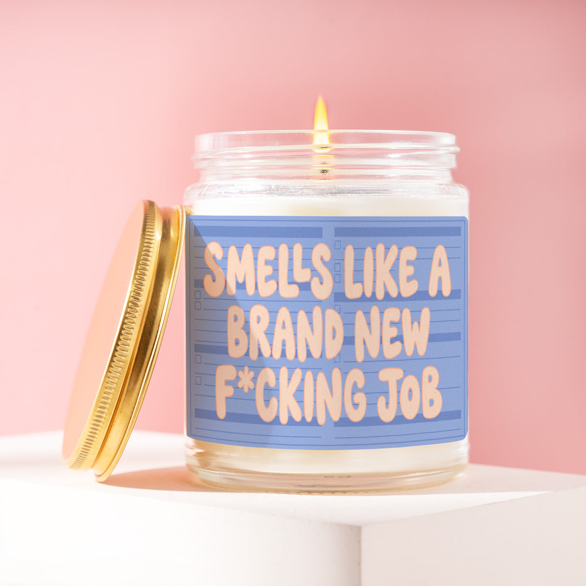 Smells Like A Brand New F*cking Job 9 oz soy candle with a brushed gold lid by James Wax