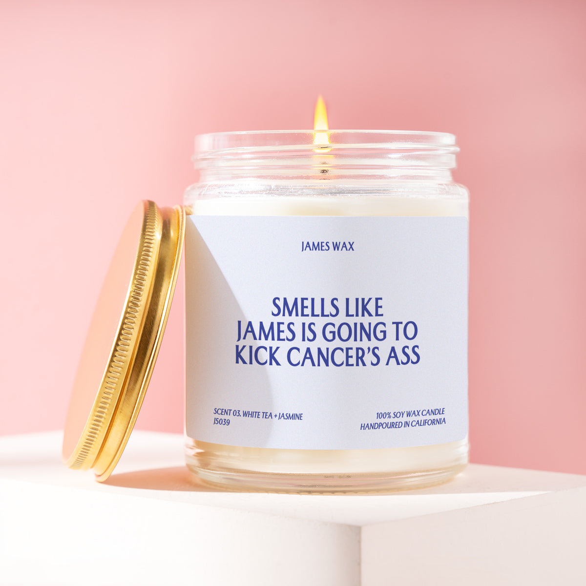 Smells Like James Is Going To Kick Cancer's Ass 9 oz soy candle with a brushed gold lid by James Wax