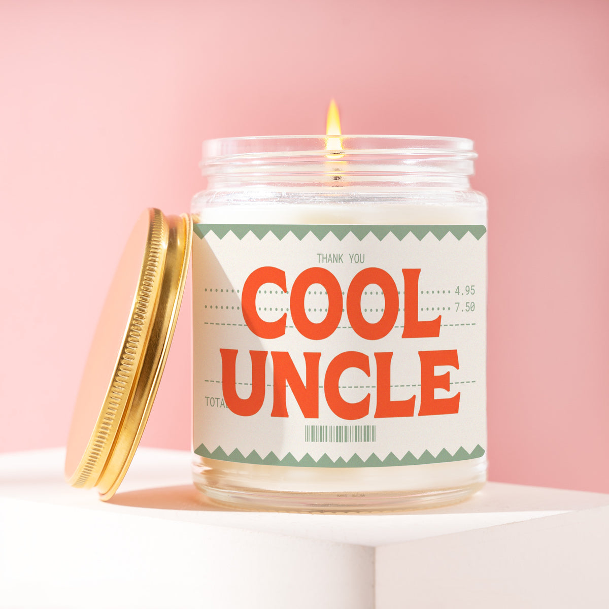 Cool Uncle 9 oz soy candle with a brushed gold lid by James Wax