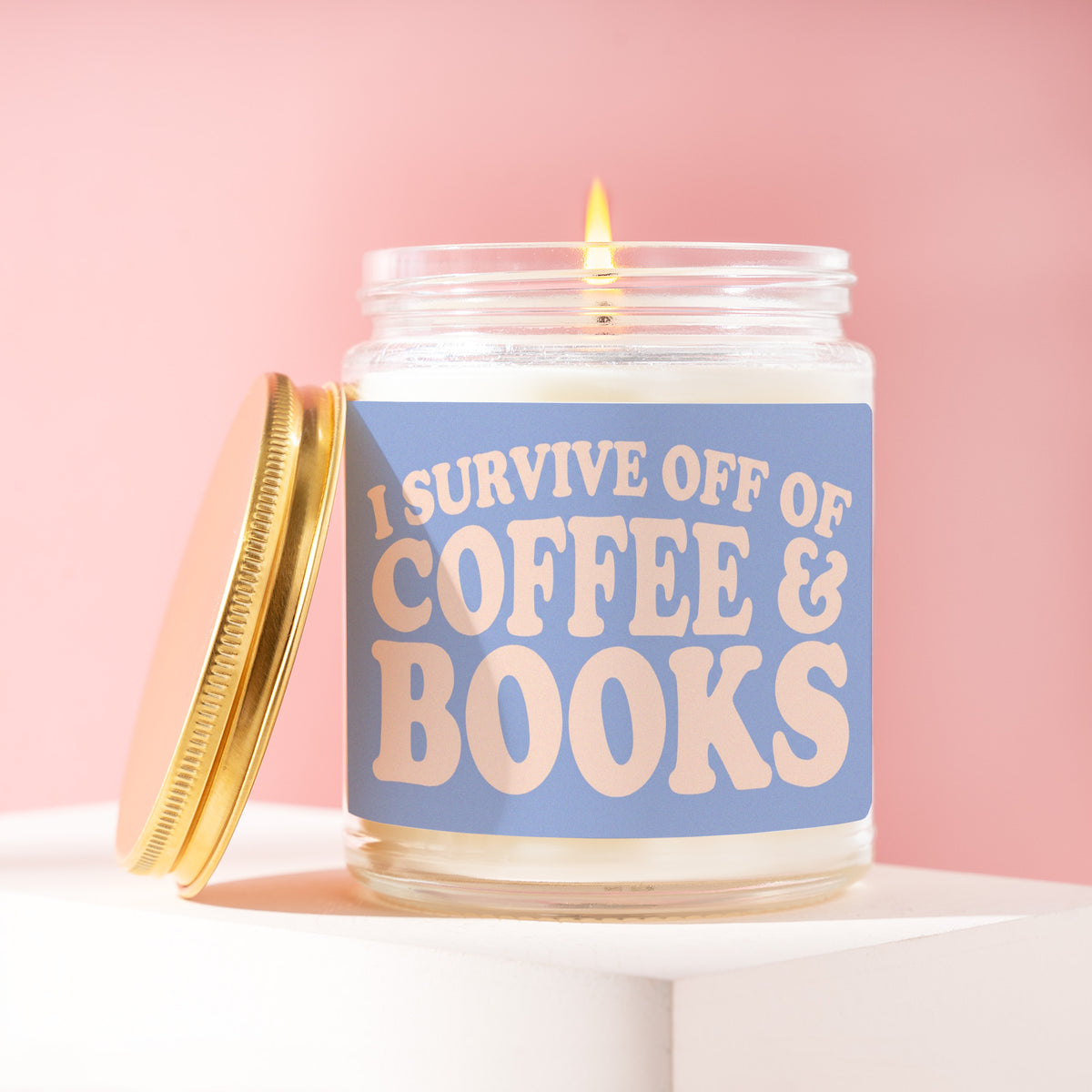 I Survive Off Of Coffee & Books 9 oz soy candle with a brushed gold lid by James Wax