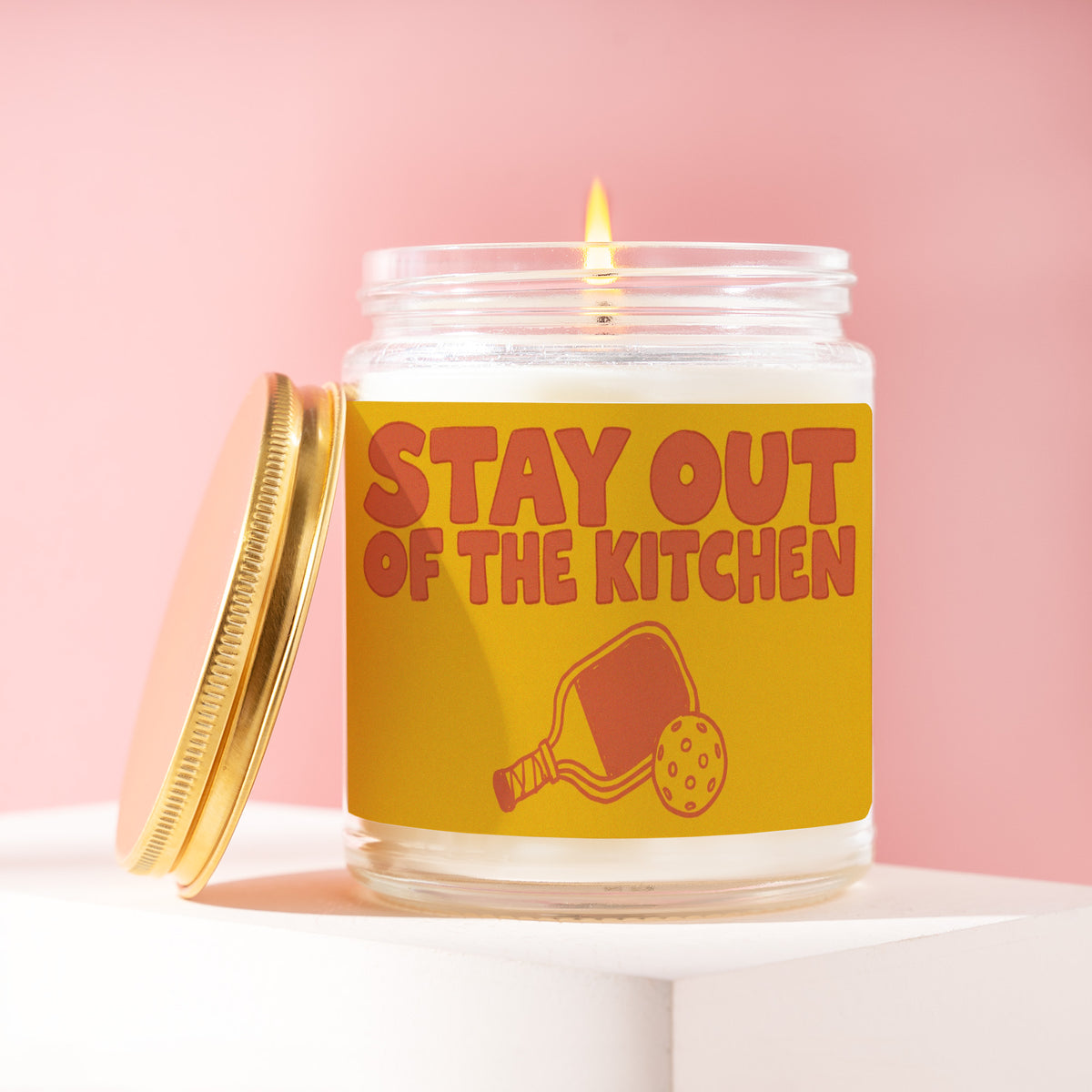 Stay Out Of The Kitchen 9 oz soy candle with a brushed gold lid by James Wax