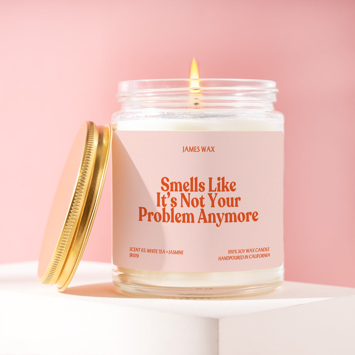 Smells Like It's Not Your Problem Anymore 9 oz soy candle with a brushed gold lid by James Wax