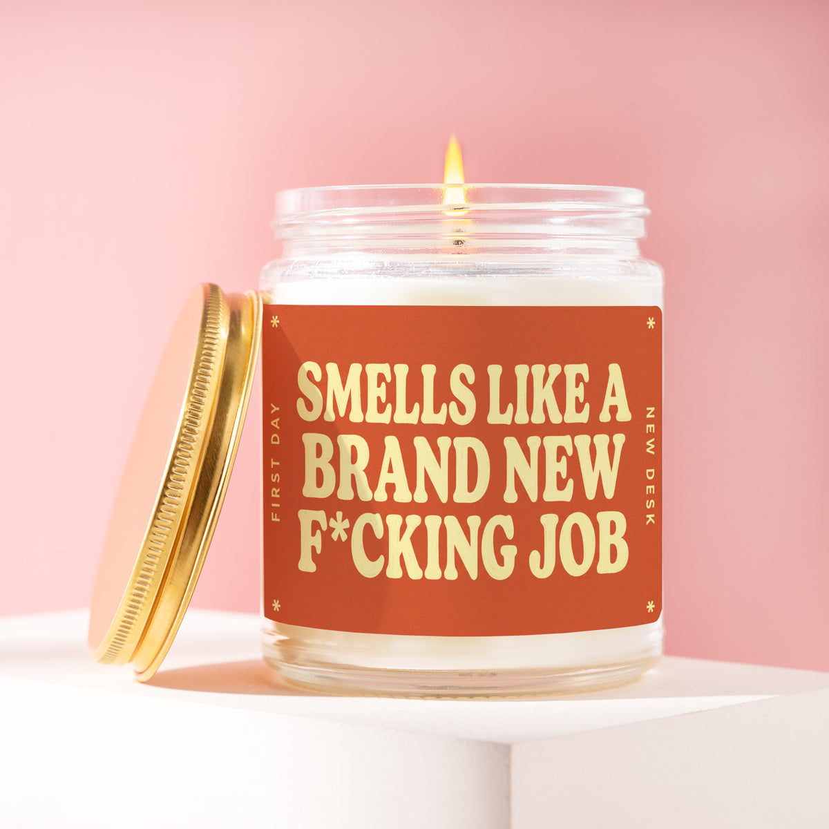 Smells Like A Brand New F*cking Job 9 oz soy candle with a brushed gold lid by James Wax