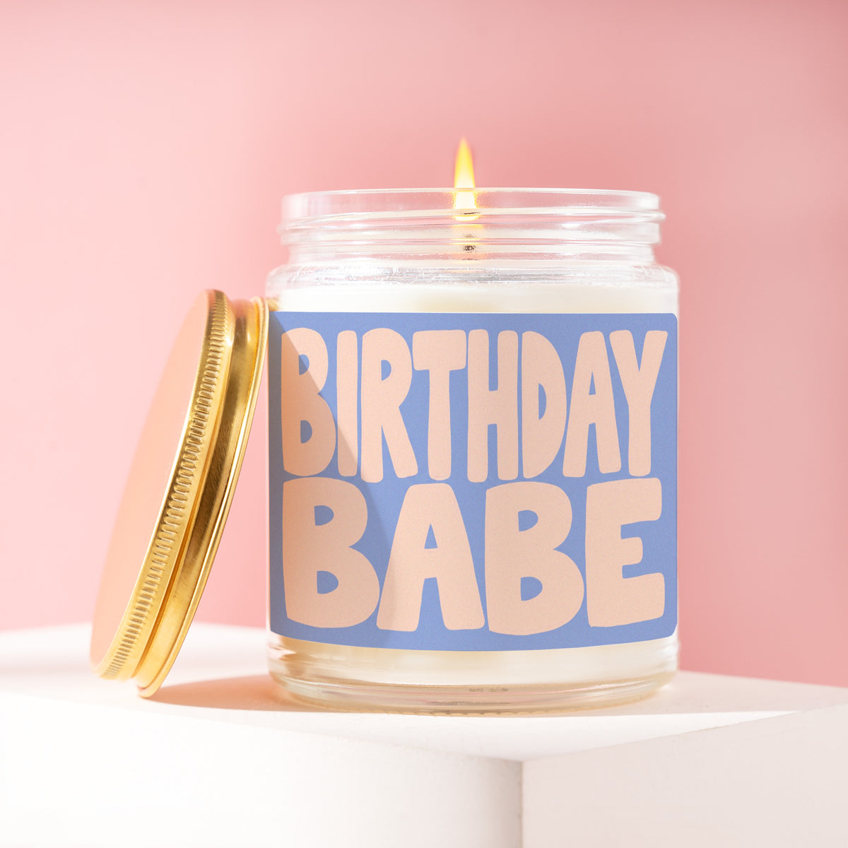 Birthday Babe 9 oz soy candle with a brushed gold lid by James Wax
