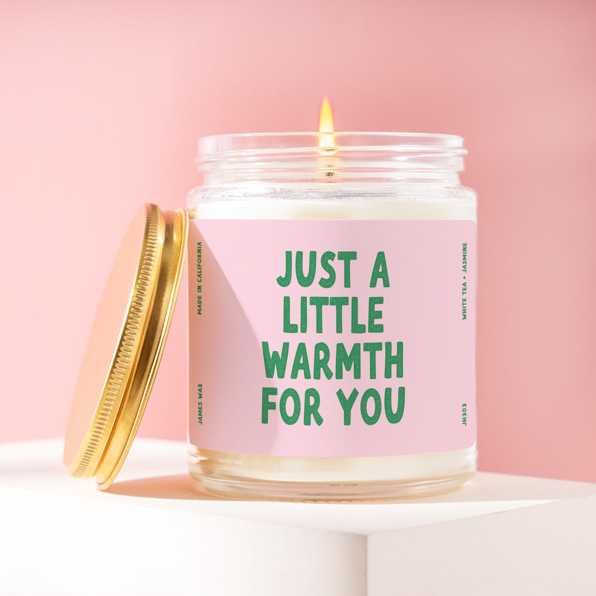 Just A Little Warmth For You 9 oz soy candle with a brushed gold lid by James Wax
