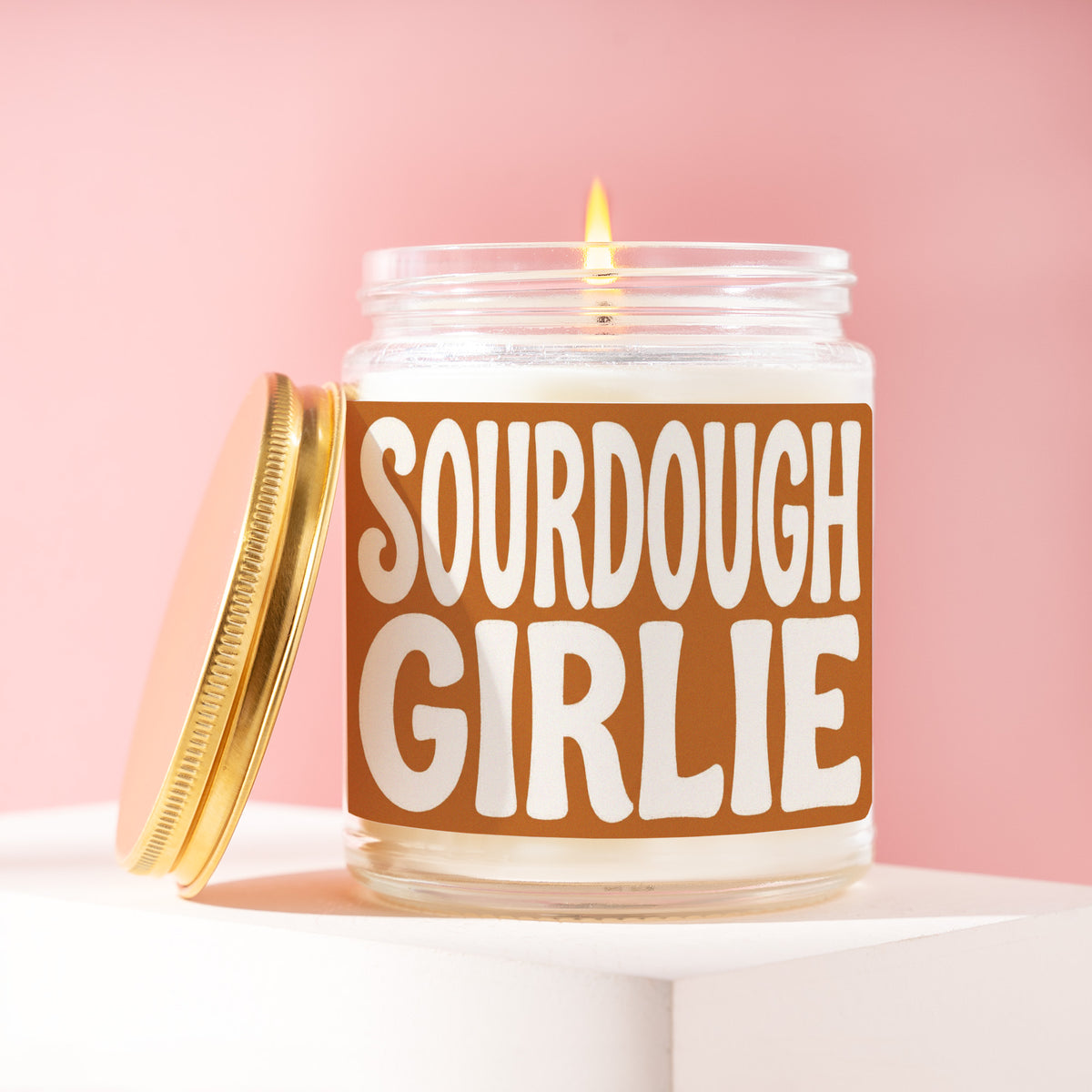 Sourdough Girlie 9 oz soy candle with a brushed gold lid by James Wax
