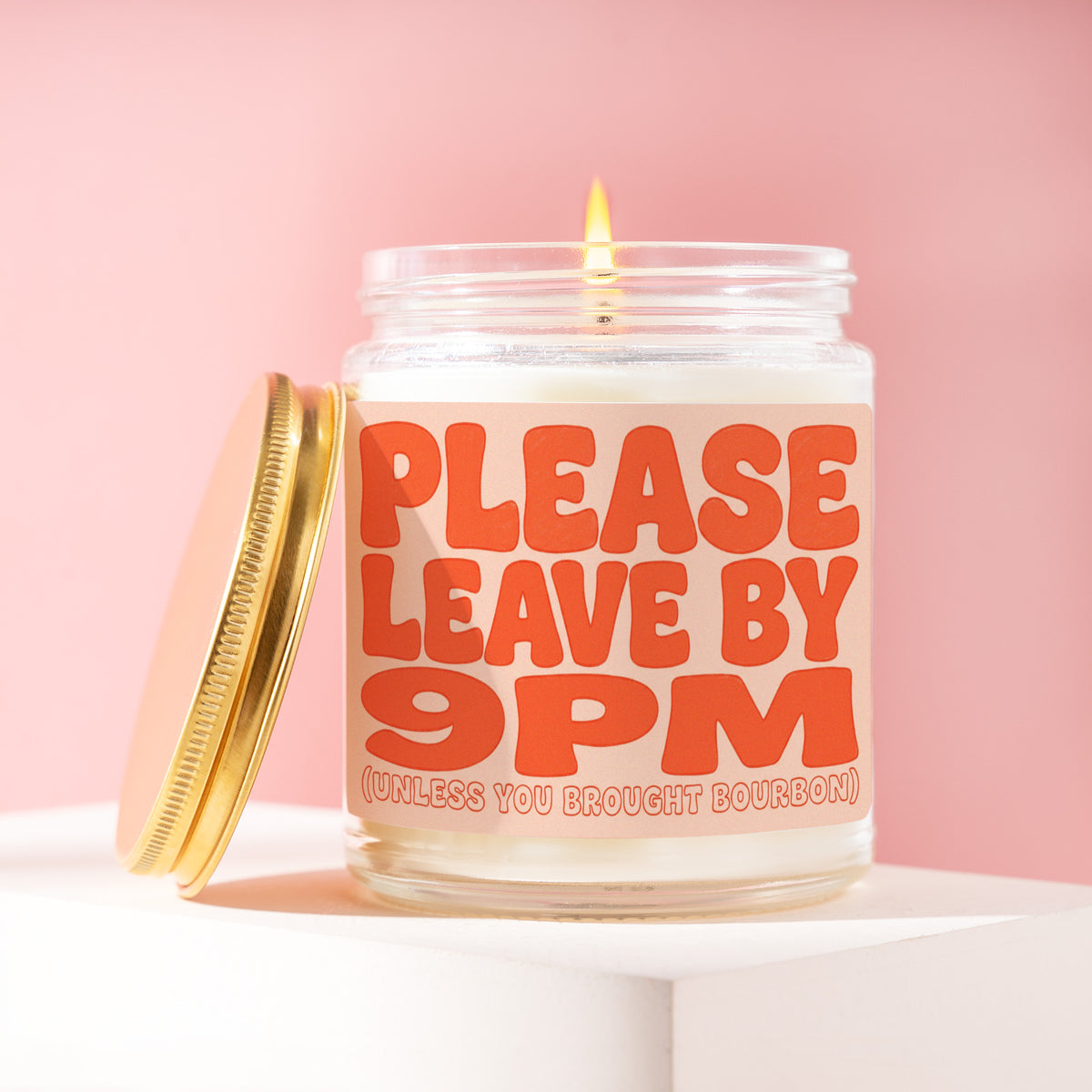 Please Leave By 9PM (Unless You Brought Bourbon) 9 oz soy candle with a brushed gold lid by James Wax