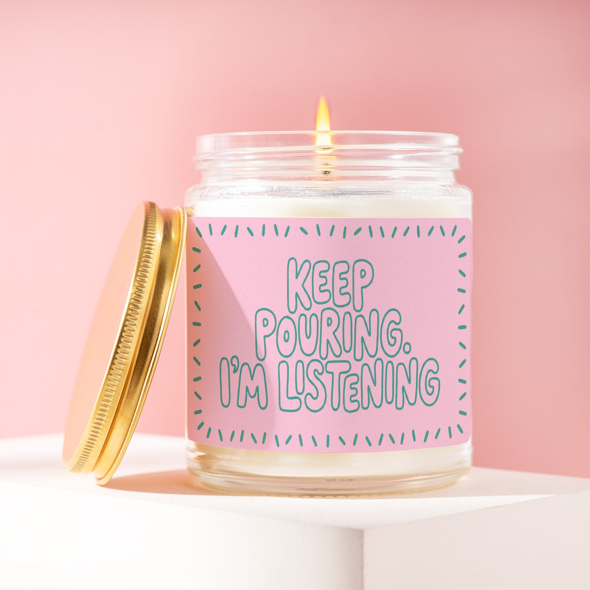 Keep Pouring. I'm Listening. 9 oz soy candle with a brushed gold lid by James Wax