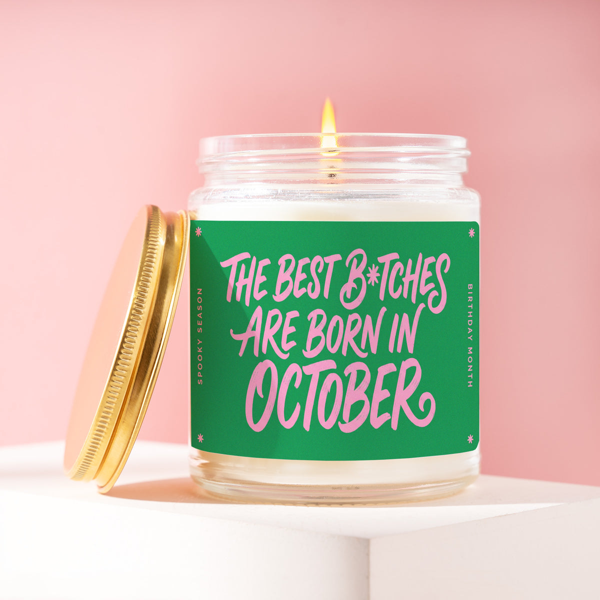 The Best B*tches Are Born In October 9 oz soy candle with a brushed gold lid by James Wax