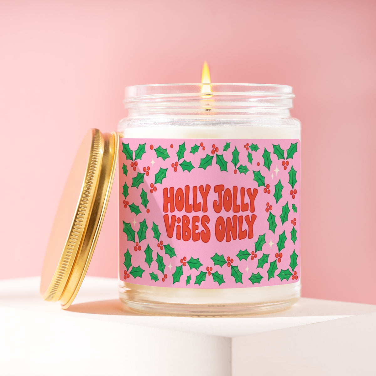 Holly Jolly Vibes Only 9 oz soy candle with a brushed gold lid by James Wax