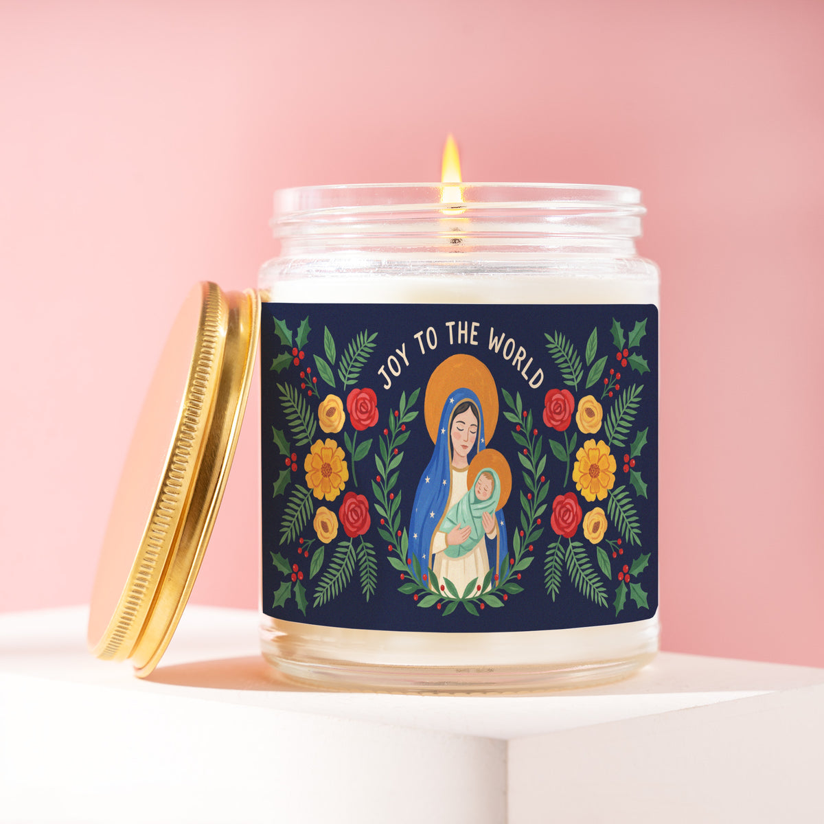 Joy To The World 9 oz soy candle with a brushed gold lid by James Wax