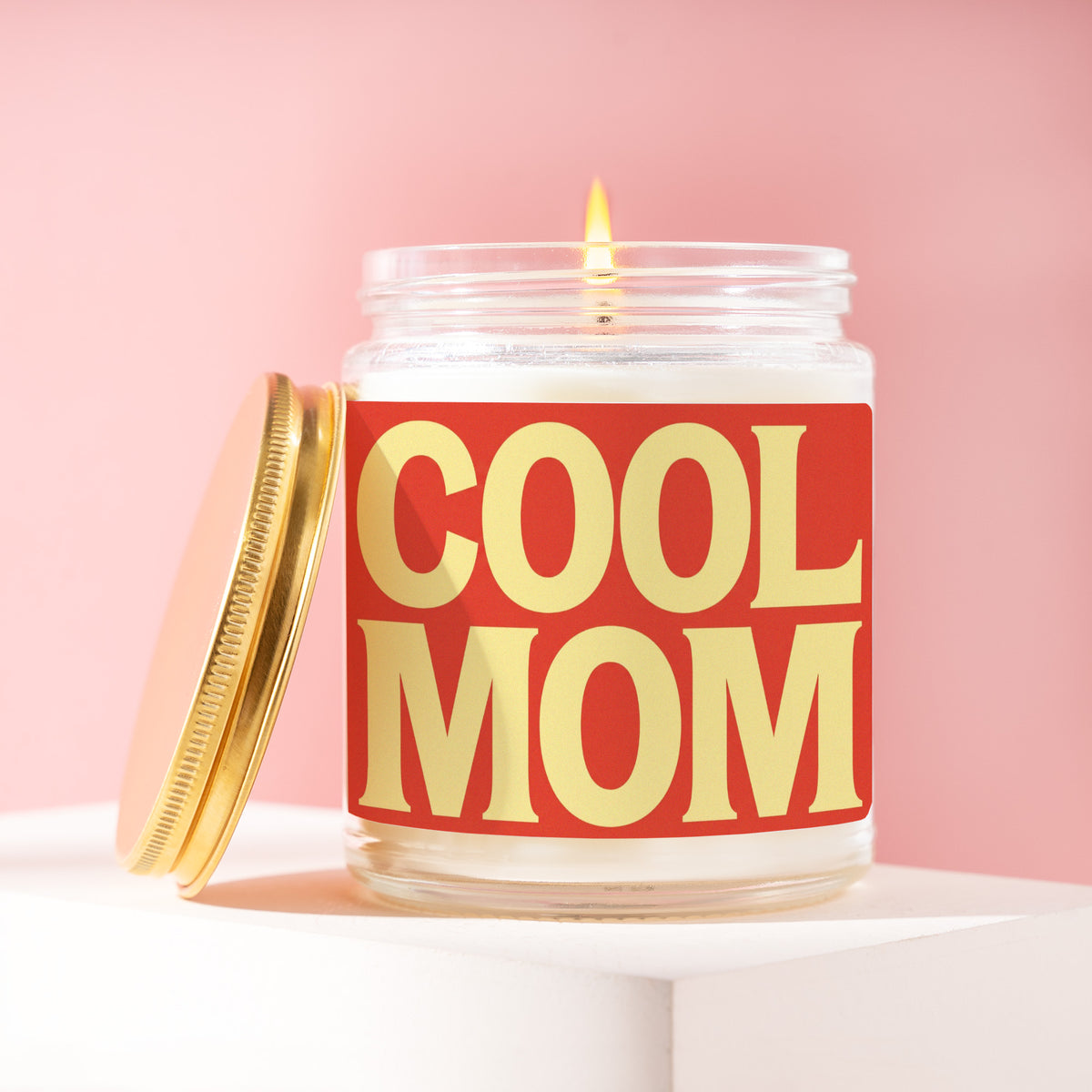 Cool Mom 9 oz soy candle with a brushed gold lid by James Wax