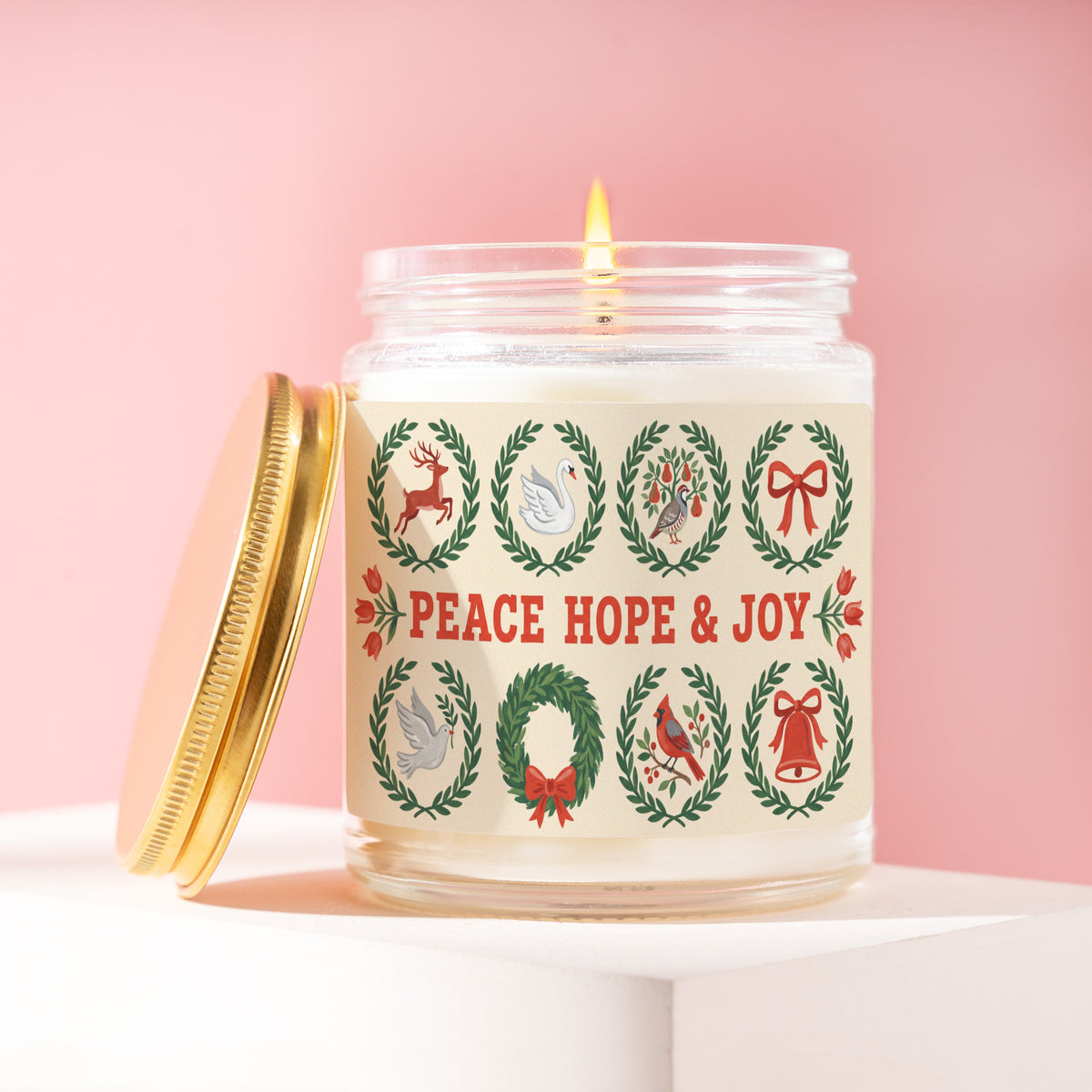 Peace Hope & Joy 9 oz soy candle with a brushed gold lid by James Wax