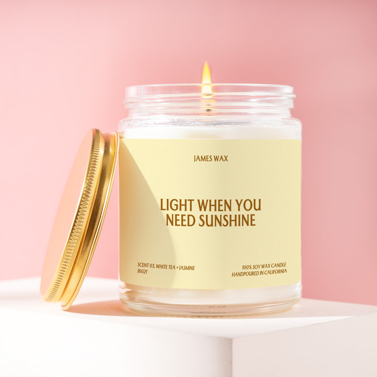 Light When You Need Sunshine 9 oz soy candle with a brushed gold lid by James Wax