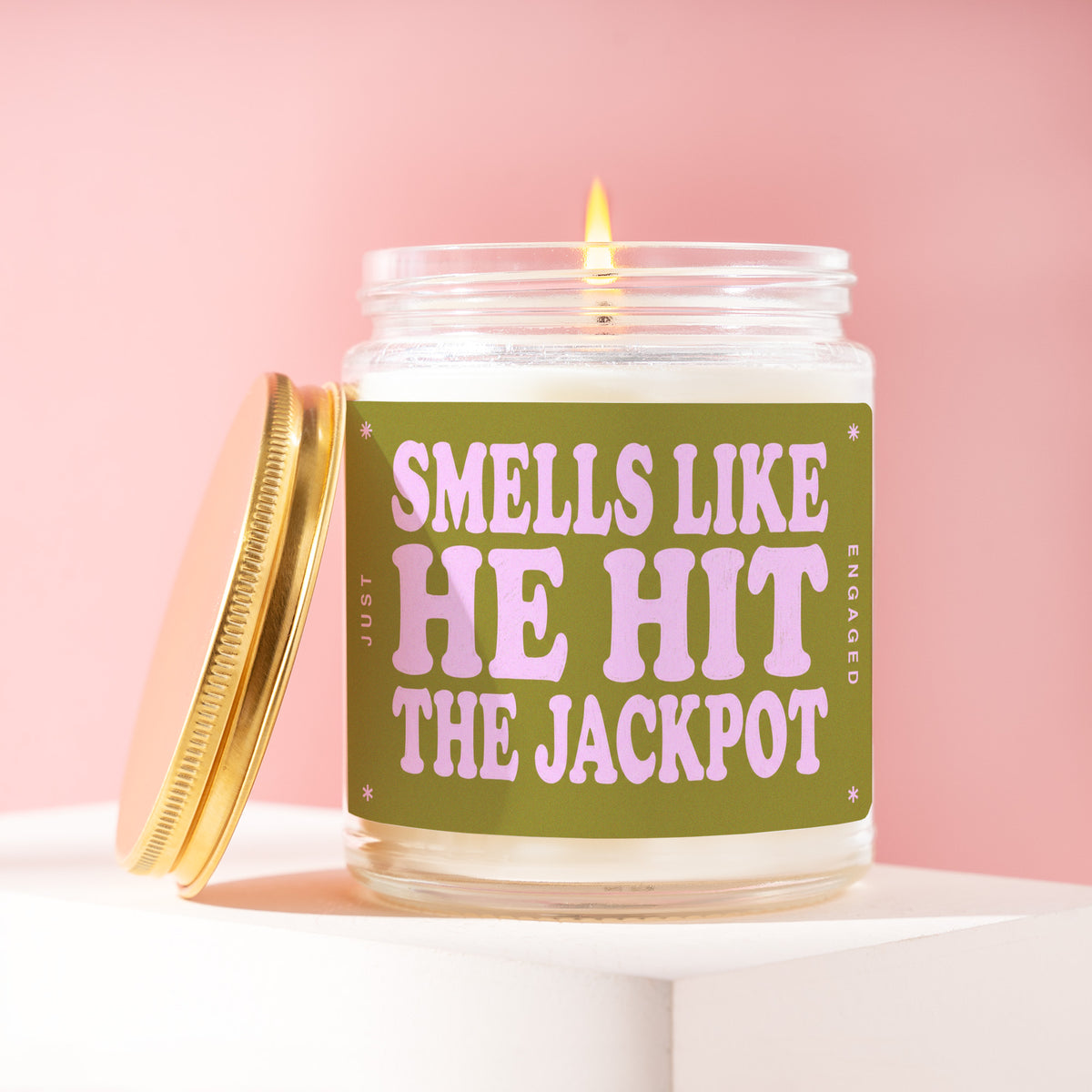 Smells Like He Hit The Jackpot 9 oz soy candle with a brushed gold lid by James Wax