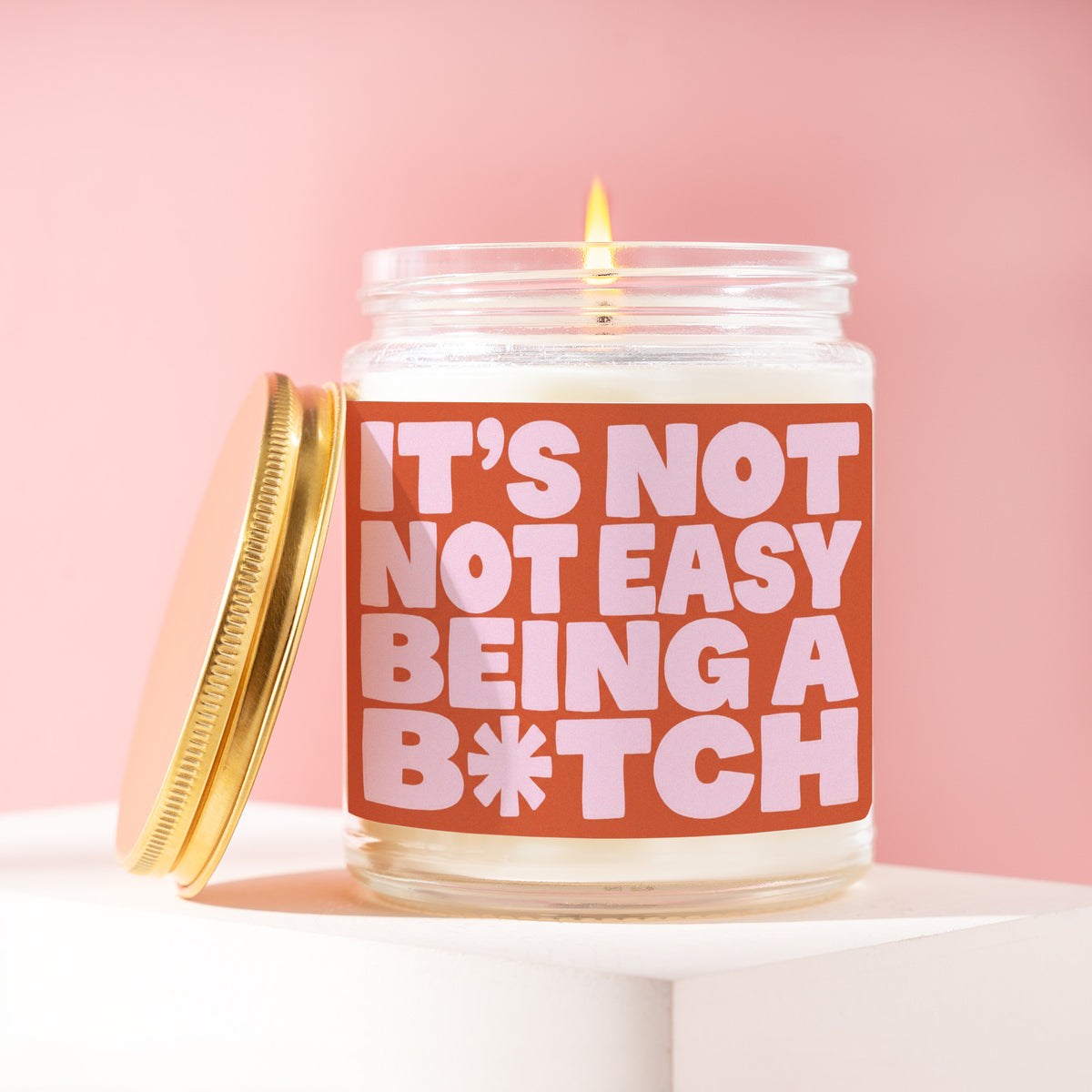 It's Not Easy Being A B*tch 9 oz soy candle with a brushed gold lid by James Wax