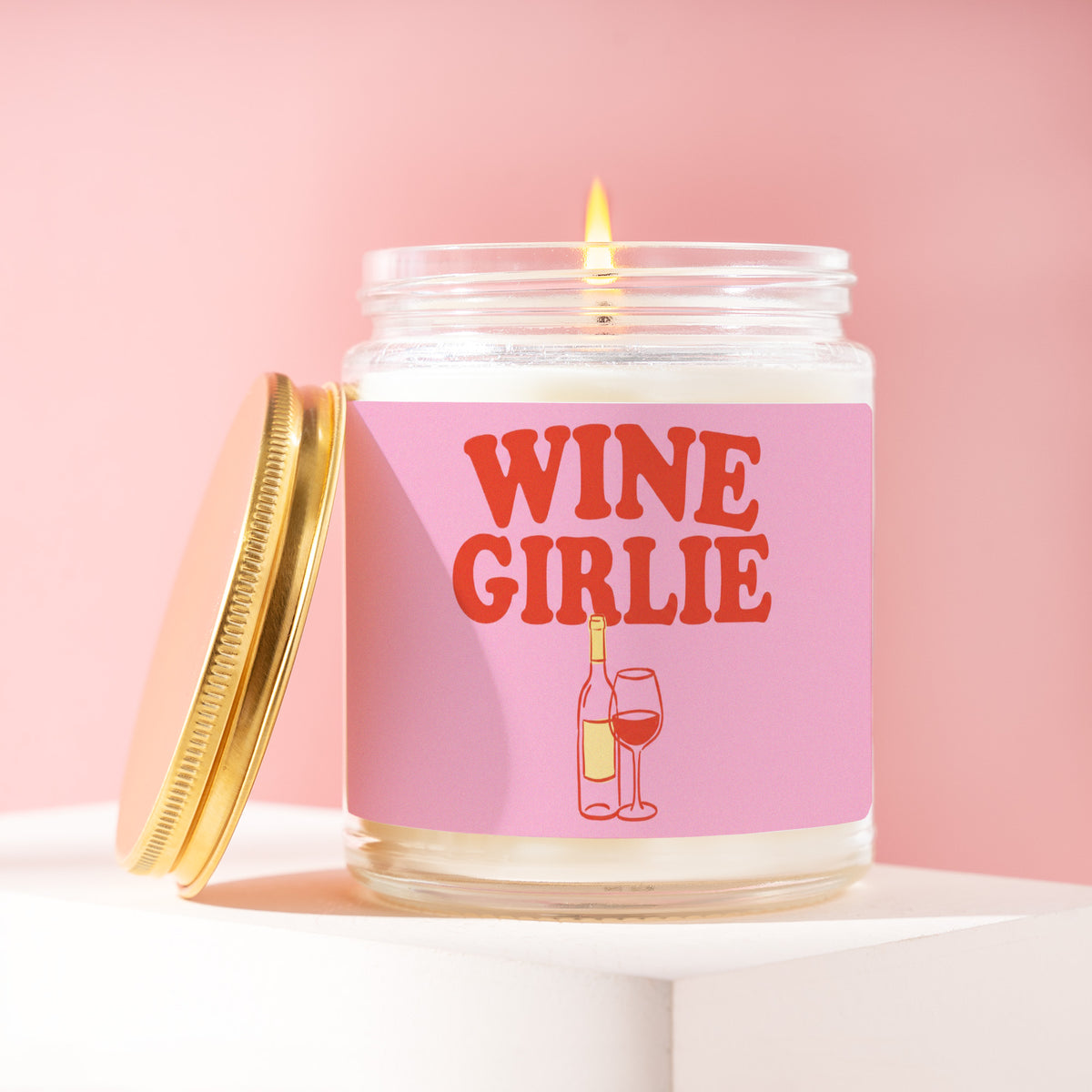 Wine Girlie 9 oz soy candle with a brushed gold lid by James Wax