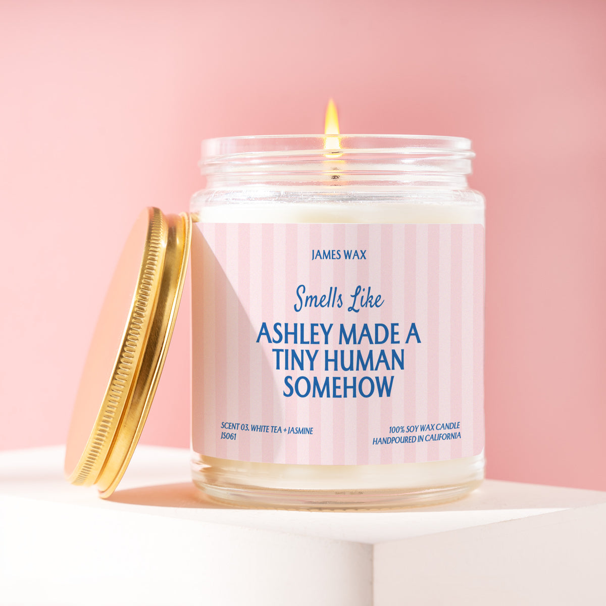 Ashley Made A Tiny Human Somehow 9 oz soy candle with a brushed gold lid by James Wax