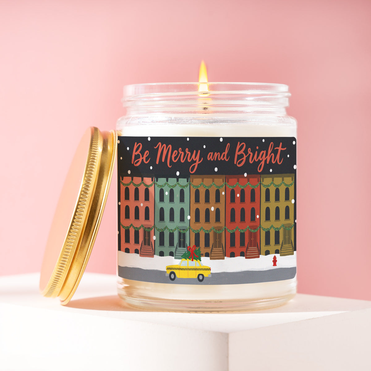 Be Merry And Bright 9 oz soy candle with a brushed gold lid by James Wax