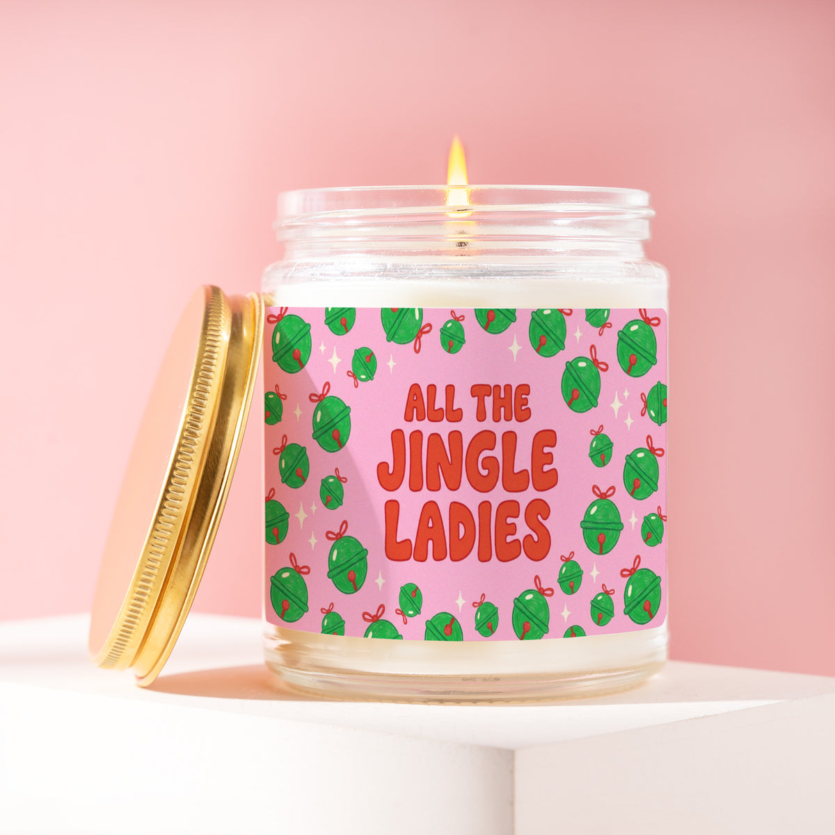 All The Jingle Ladies 9 oz soy candle with a brushed gold lid by James Wax