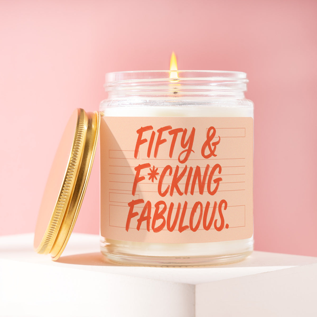 Fifty & F*cking Fabulous. 9 oz soy candle with a brushed gold lid by James Wax