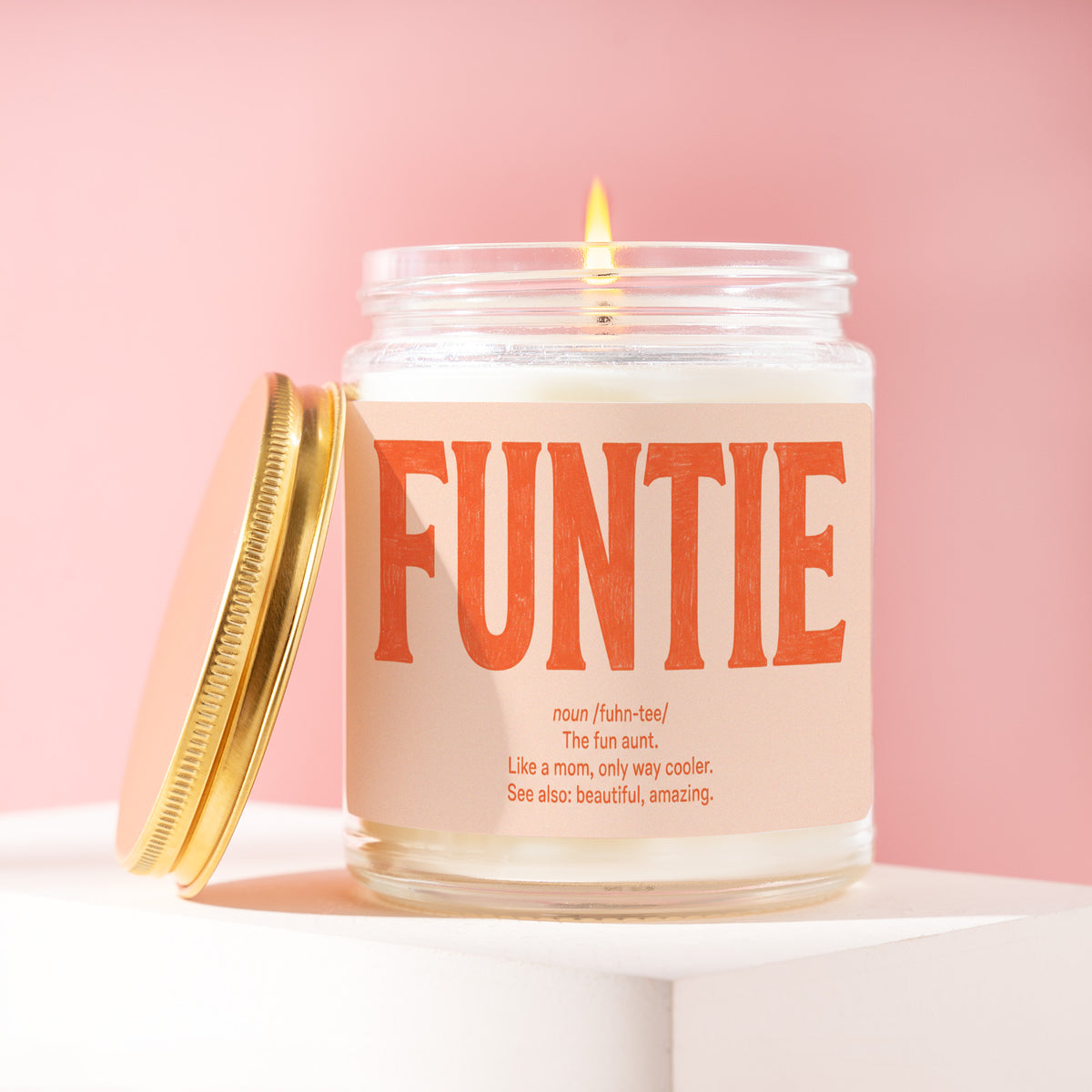Funtie 9 oz soy candle with a brushed gold lid by James Wax