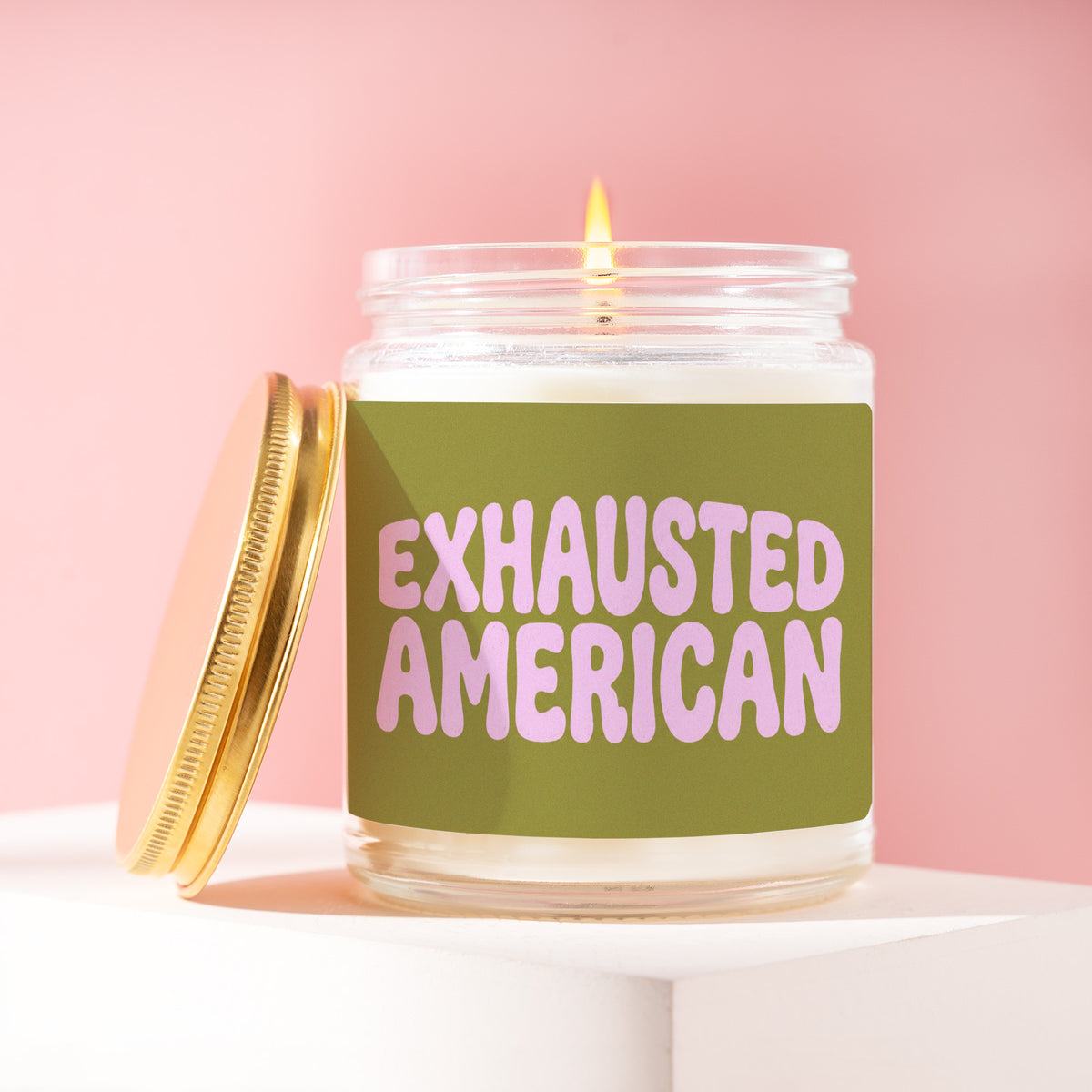 Exhausted American 9 oz soy candle with a brushed gold lid by James Wax