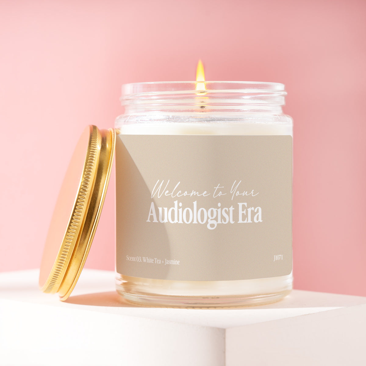 Welcome To Your Audiologist Era 9 oz soy candle with a brushed gold lid by James Wax