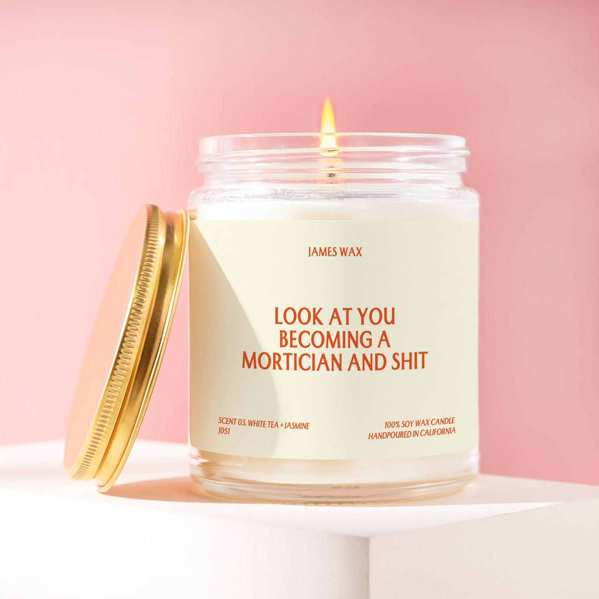 Look At You Becoming A Mortician And Shit 9 oz soy candle with a brushed gold lid by James Wax
