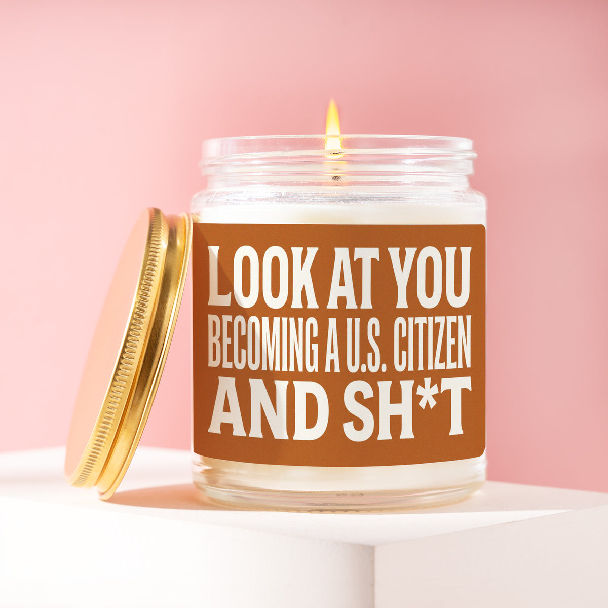 Look At You Becoming A U.S. Citizen And Sh*t 9 oz soy candle with a brushed gold lid by James Wax