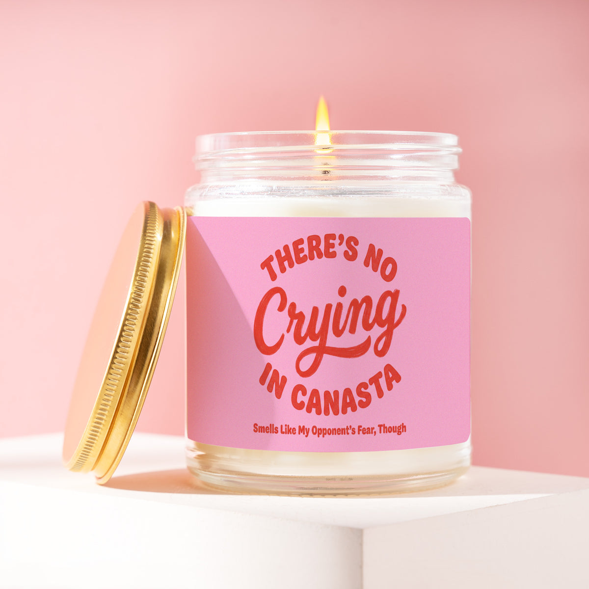 There's No Crying In Canasta. Smells Like My Opponents' Fear Though 9 oz soy candle with a brushed gold lid by James Wax