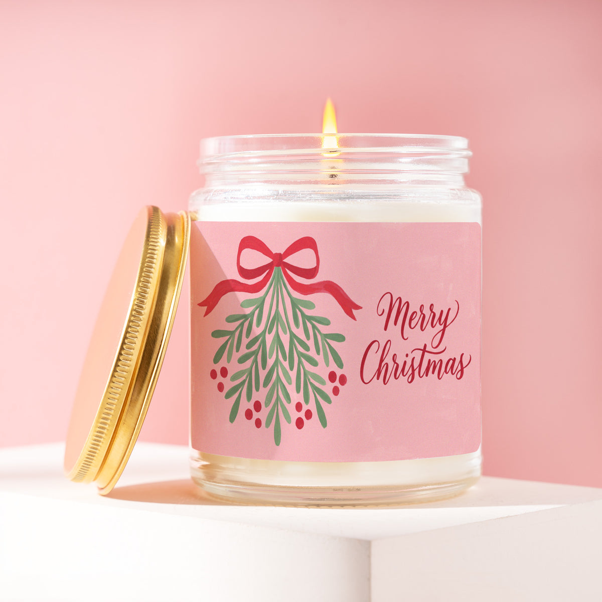 Merry Christmas 9 oz soy candle with a brushed gold lid by James Wax