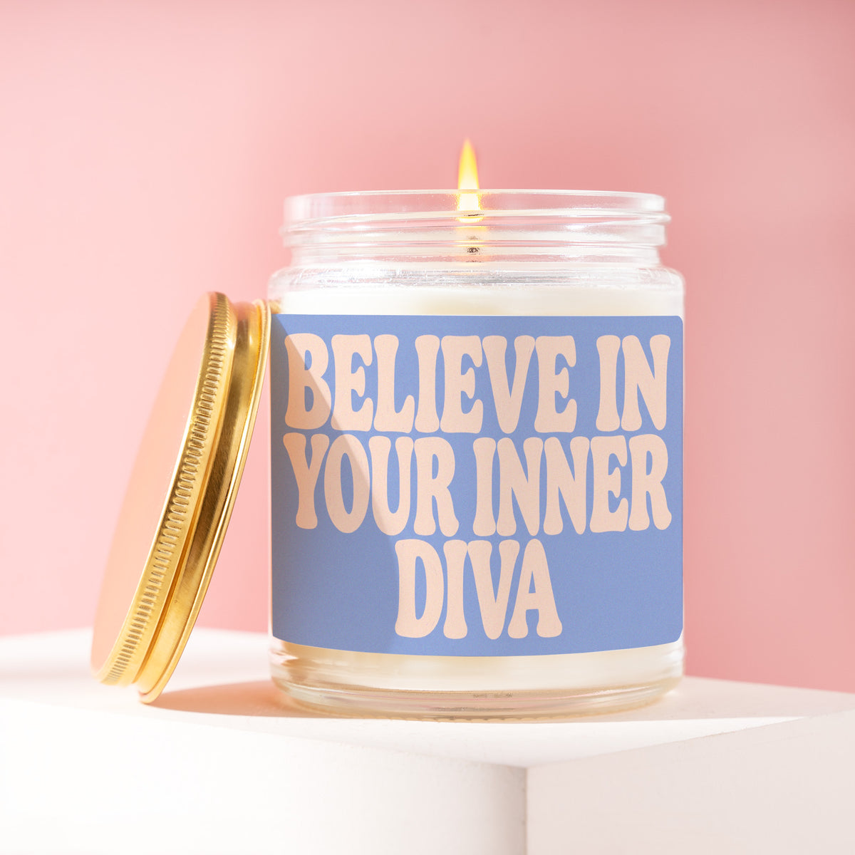 Believe In Your Inner Diva 9 oz soy candle with a brushed gold lid by James Wax