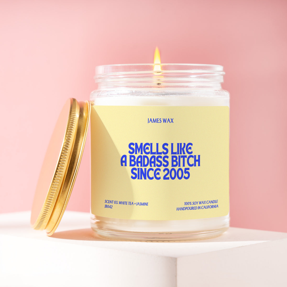 Smells Like A Badass Bitch Since 2005 9 oz soy candle with a brushed gold lid by James Wax