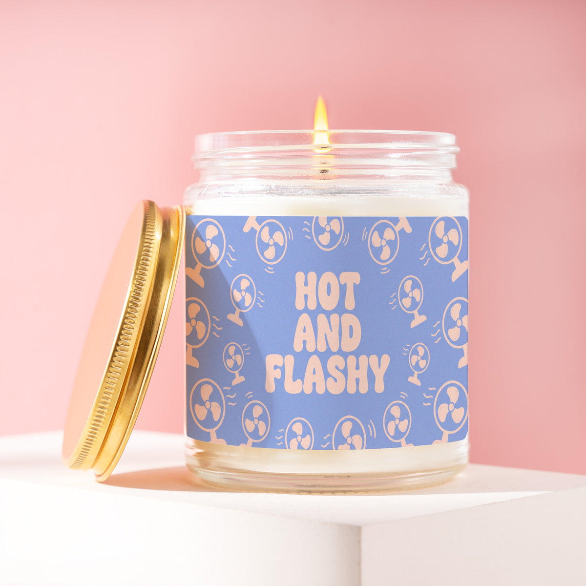 Hot And Flashy 9 oz soy candle with a brushed gold lid by James Wax