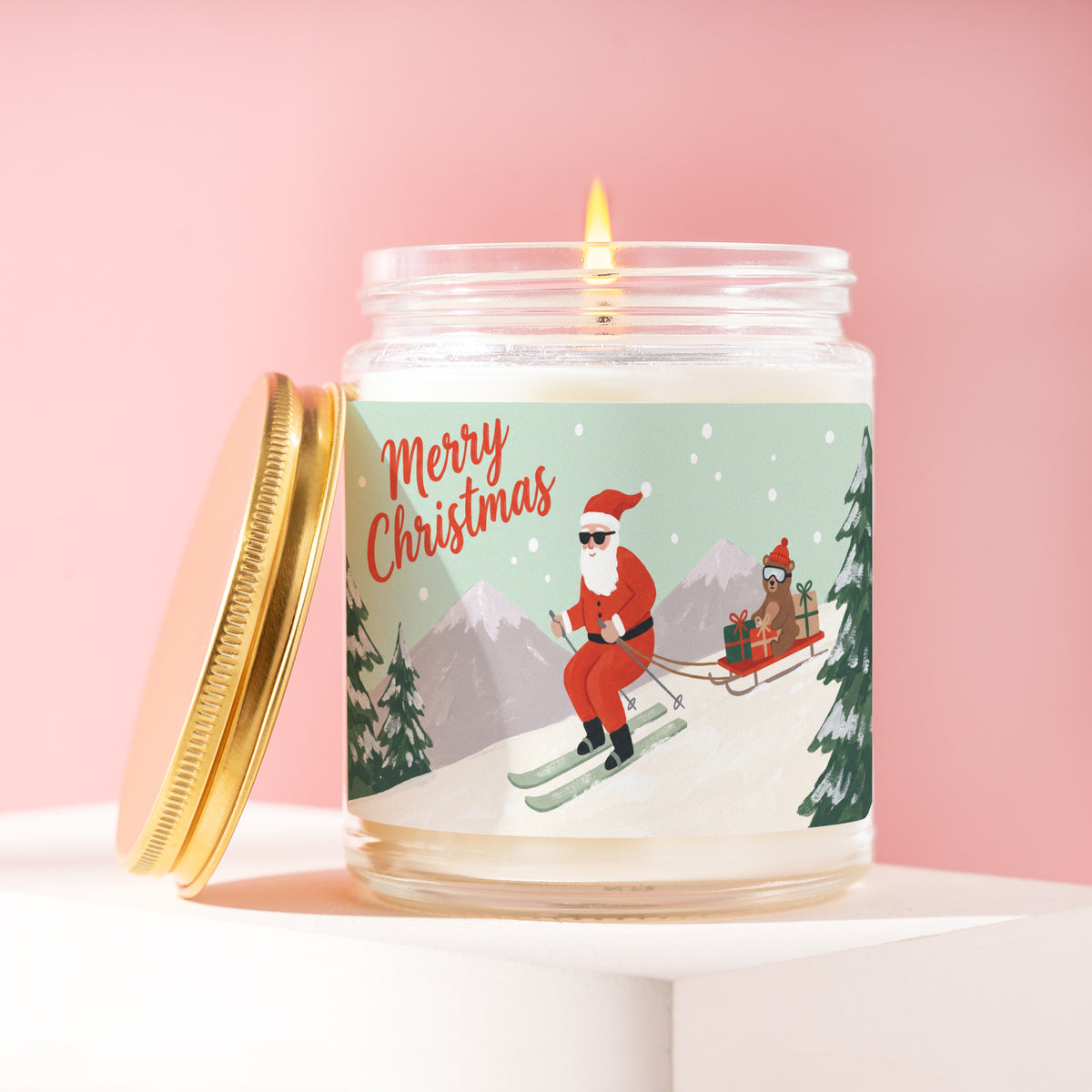 Merry Christmas 9 oz soy candle with a brushed gold lid by James Wax