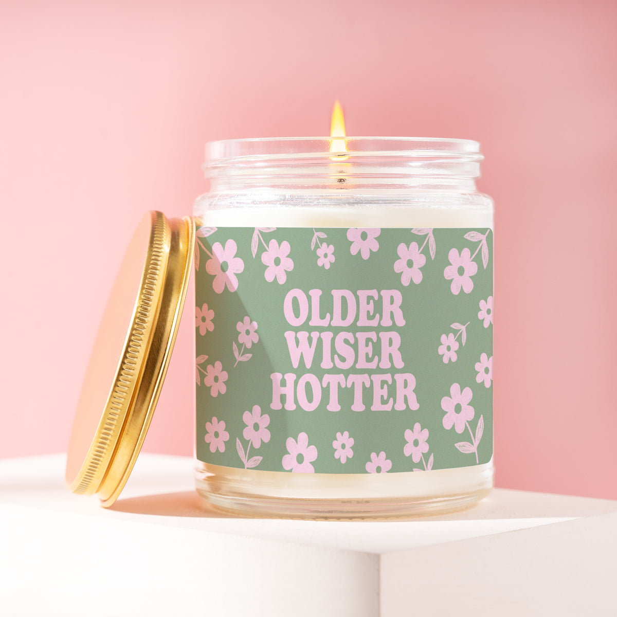 Older Wiser Hotter 9 oz soy candle with a brushed gold lid by James Wax