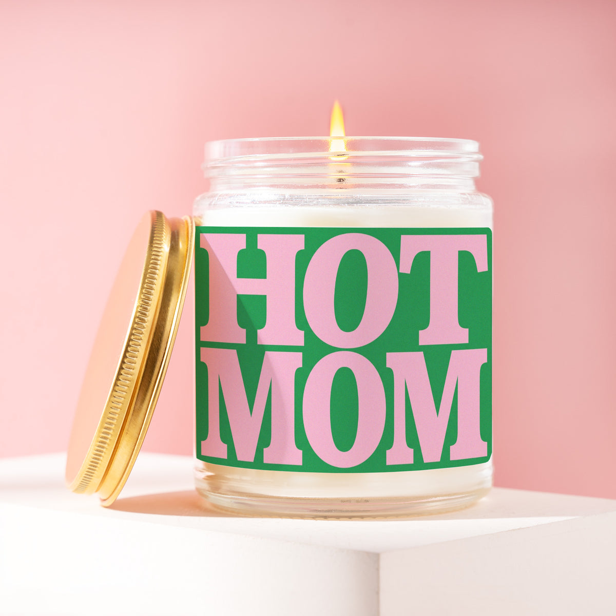 Hot Mom 9 oz soy candle with a brushed gold lid by James Wax