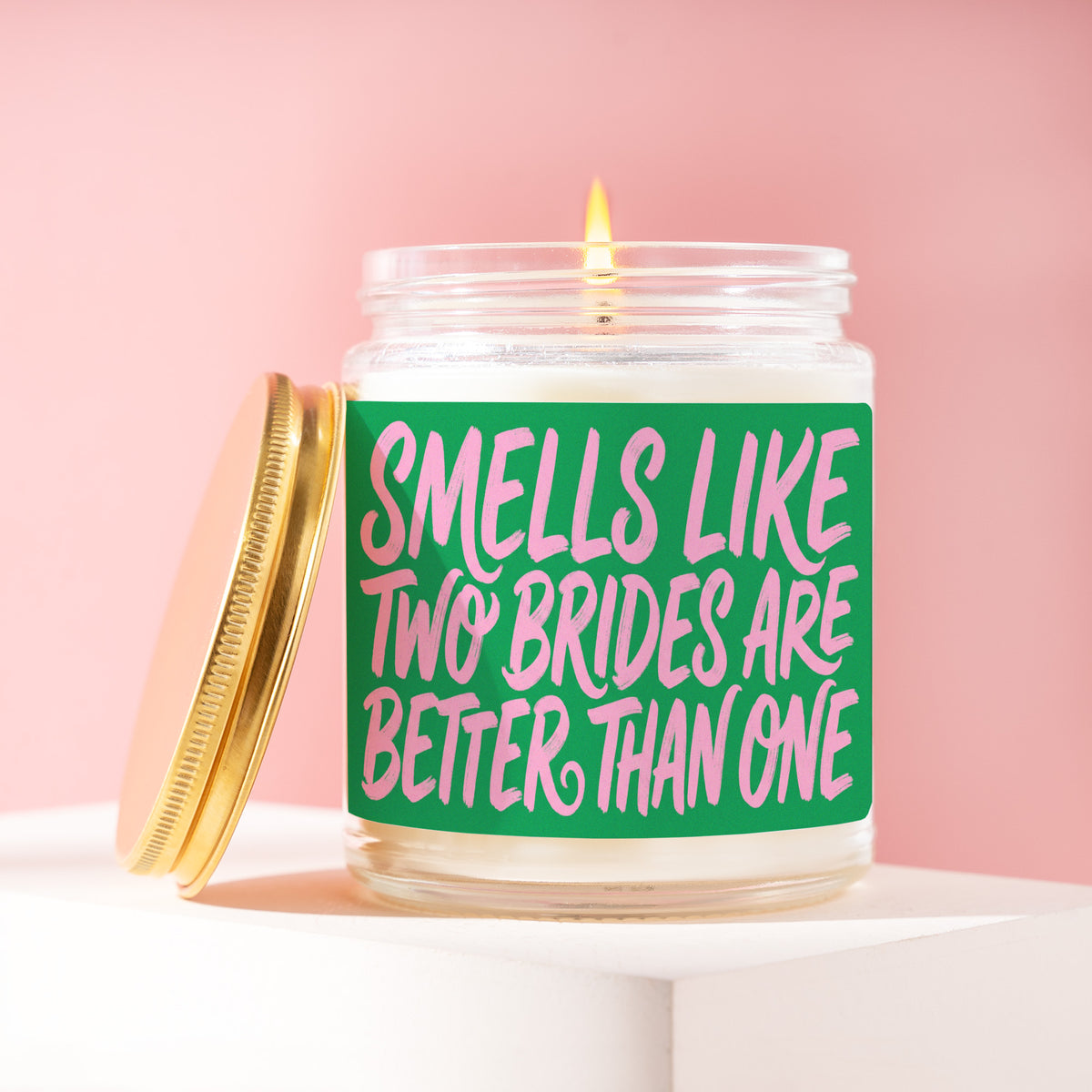 Smells Like Two Brides Are Better Than One 9 oz soy candle with a brushed gold lid by James Wax
