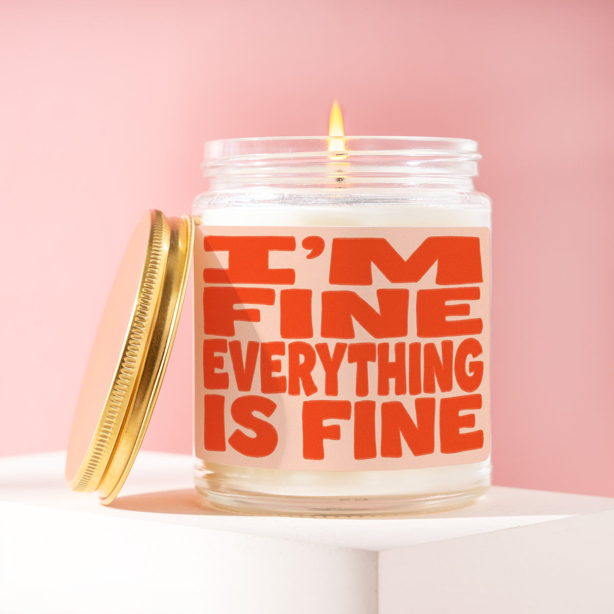 I'm Fine Everything Is Fine 9 oz soy candle with a brushed gold lid by James Wax