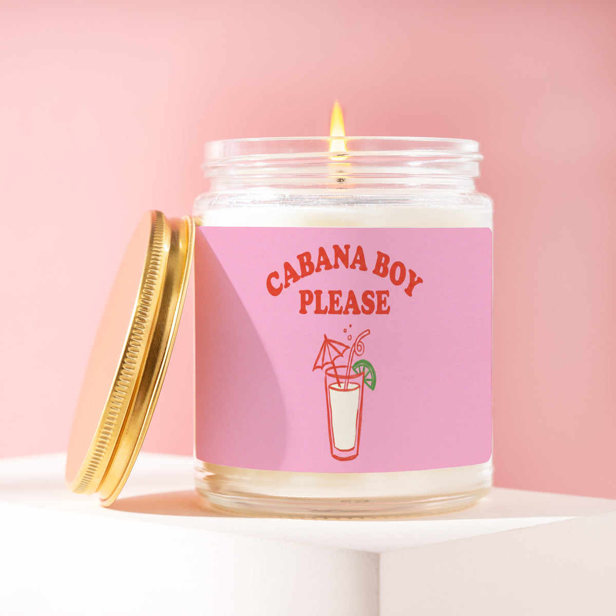 Cabana Boy Please 9 oz soy candle with a brushed gold lid by James Wax