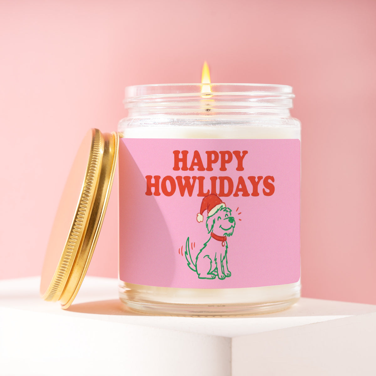 Happy Howlidays 9 oz soy candle with a brushed gold lid by James Wax