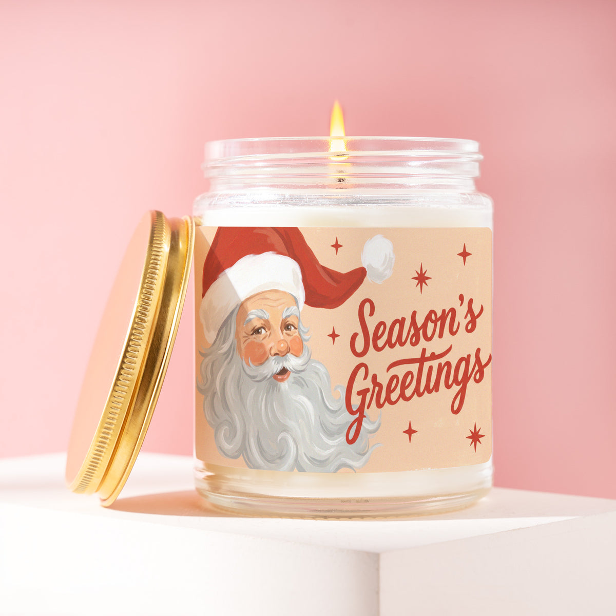 Season's Greetings 9 oz soy candle with a brushed gold lid by James Wax