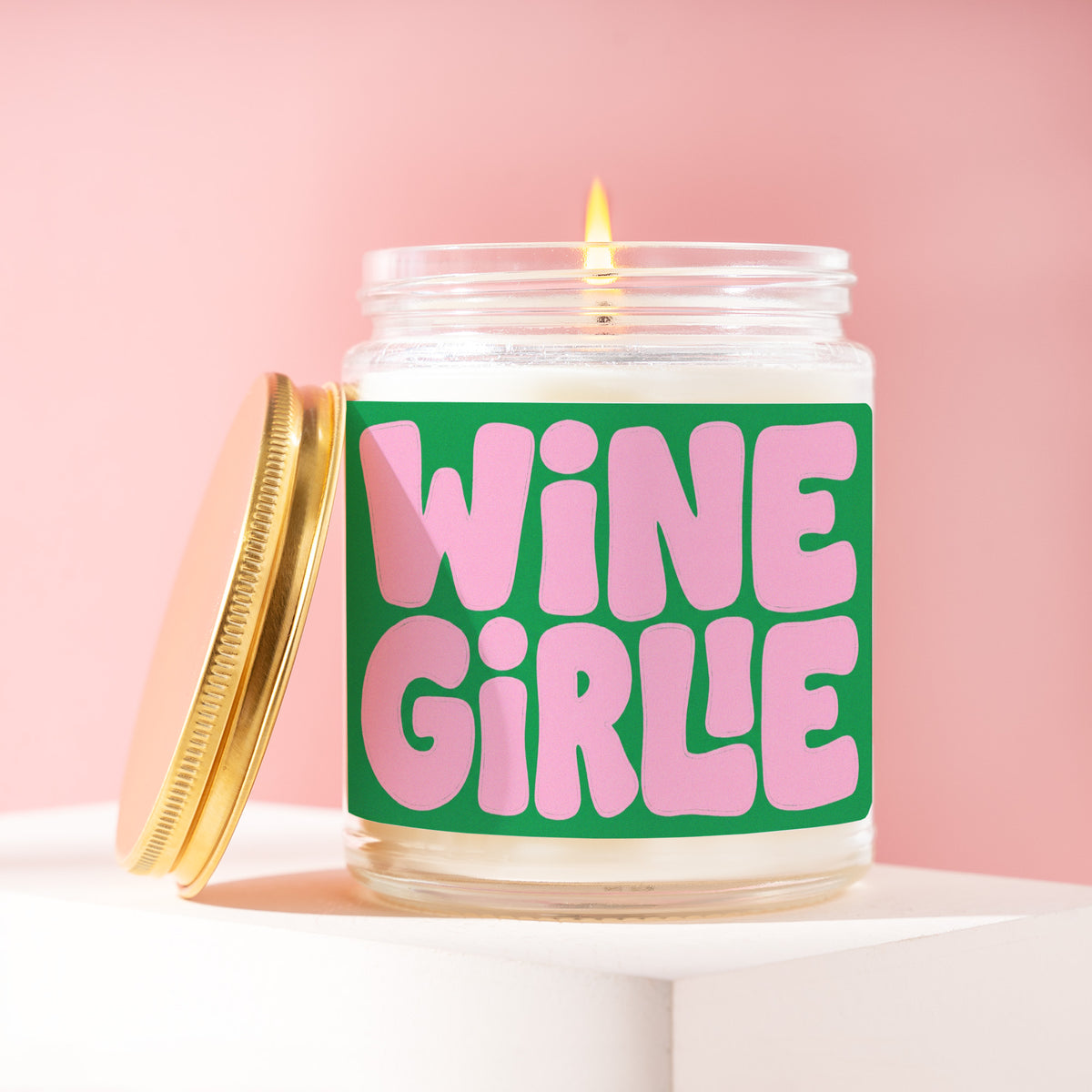 Wine Girlie 9 oz soy candle with a brushed gold lid by James Wax