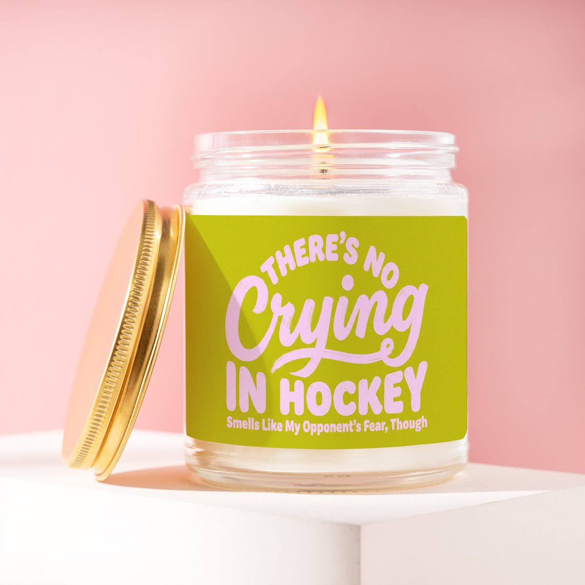 There's No Crying In Hockey, Smells Like My Opponent's Fear, Though 9 oz soy candle with a brushed gold lid by James Wax